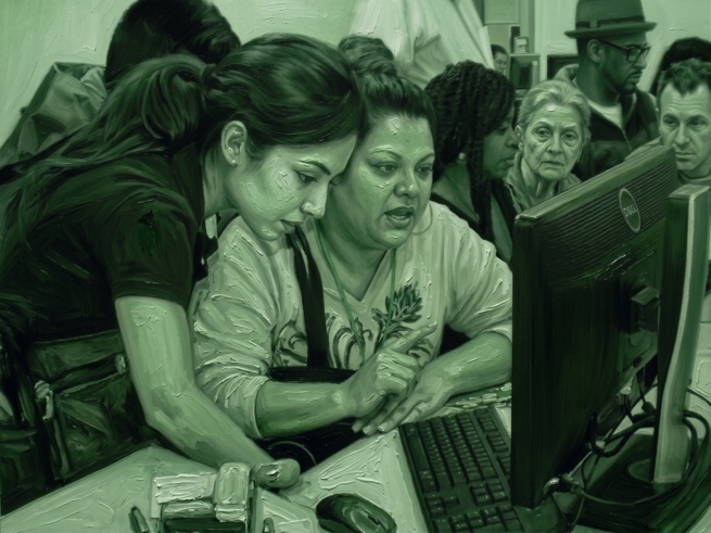A school staff member leaning in beside a mother at a computer, guiding her through a screen while others wait behind them